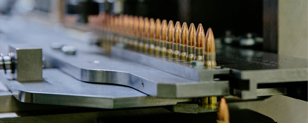 Close-up of ammunition lined up in a row.