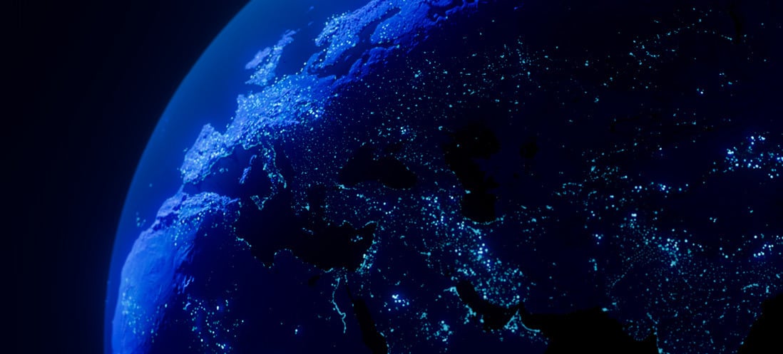 Europe and North Africa seen from space at night, with cities glowing in blue.